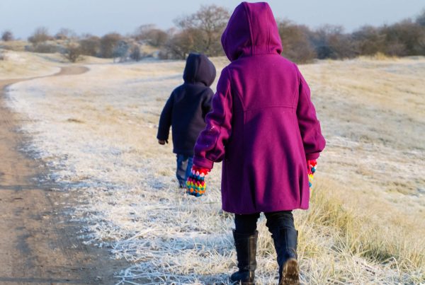 Small children in frosty landscape