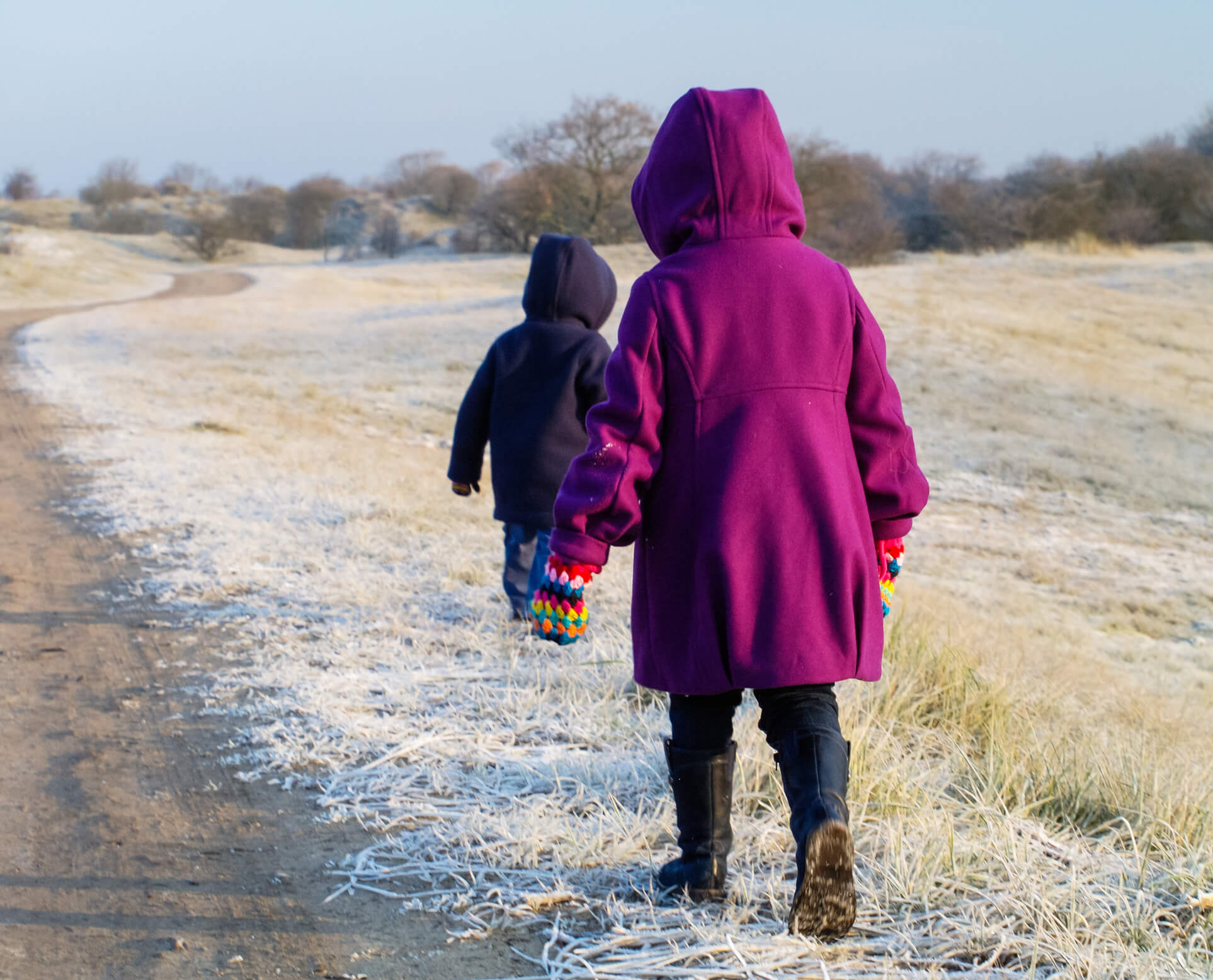 Small children in frosty landscape