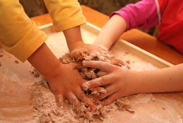 Hard working children. Making cake