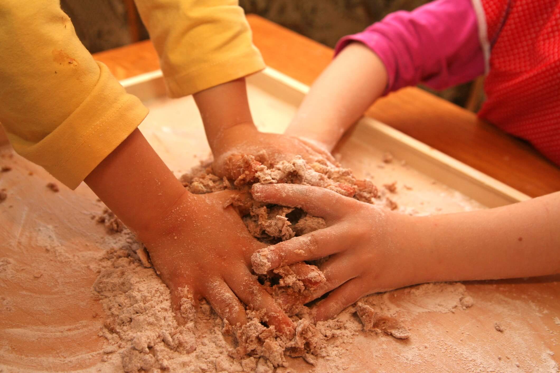 Hard working children. Making cake
